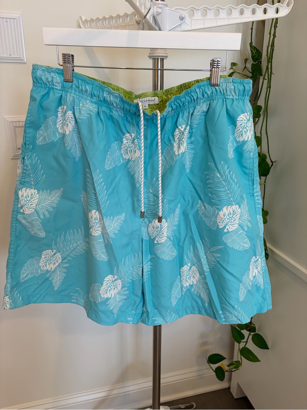Men's Light Blue Tropical Swim Trunks with White Leaf Print